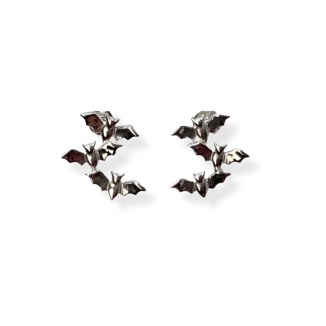 Sterling silver earrings featuring three intricately detailed bats in a cascading formation, Bewitching Bat Earrings