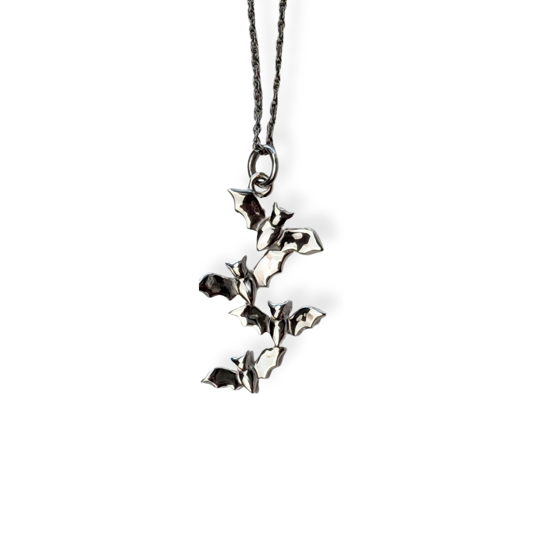 Sterling silver necklace featuring a cascading formation of five bats, Bewitching Bats Necklace