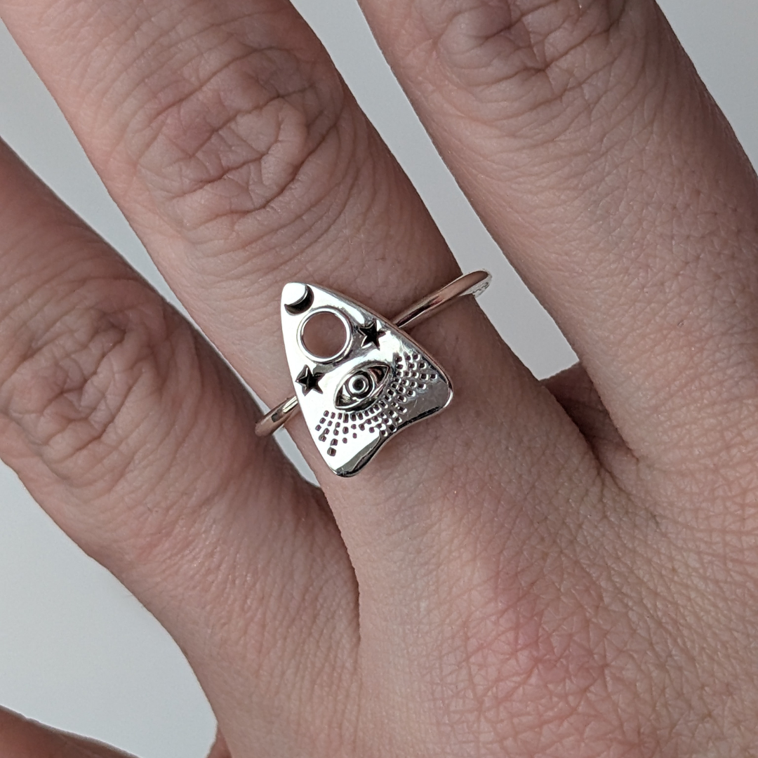 Oracle Ring in sterling silver with mystical eye, moon, and star symbols.