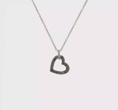 Polished sterling silver heart shaped pendant with pavé set black diamonds and white diamond studded bail on a sleek silver chain